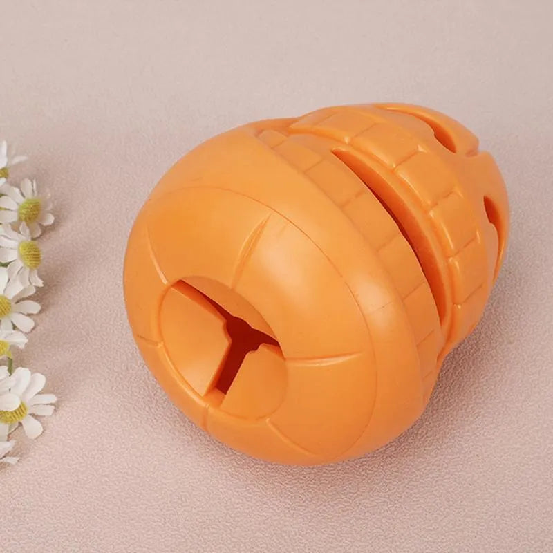 Yellow pumpkin-shaped TPR dog chew toy for aggressive chewers, 8.6x11.5cm