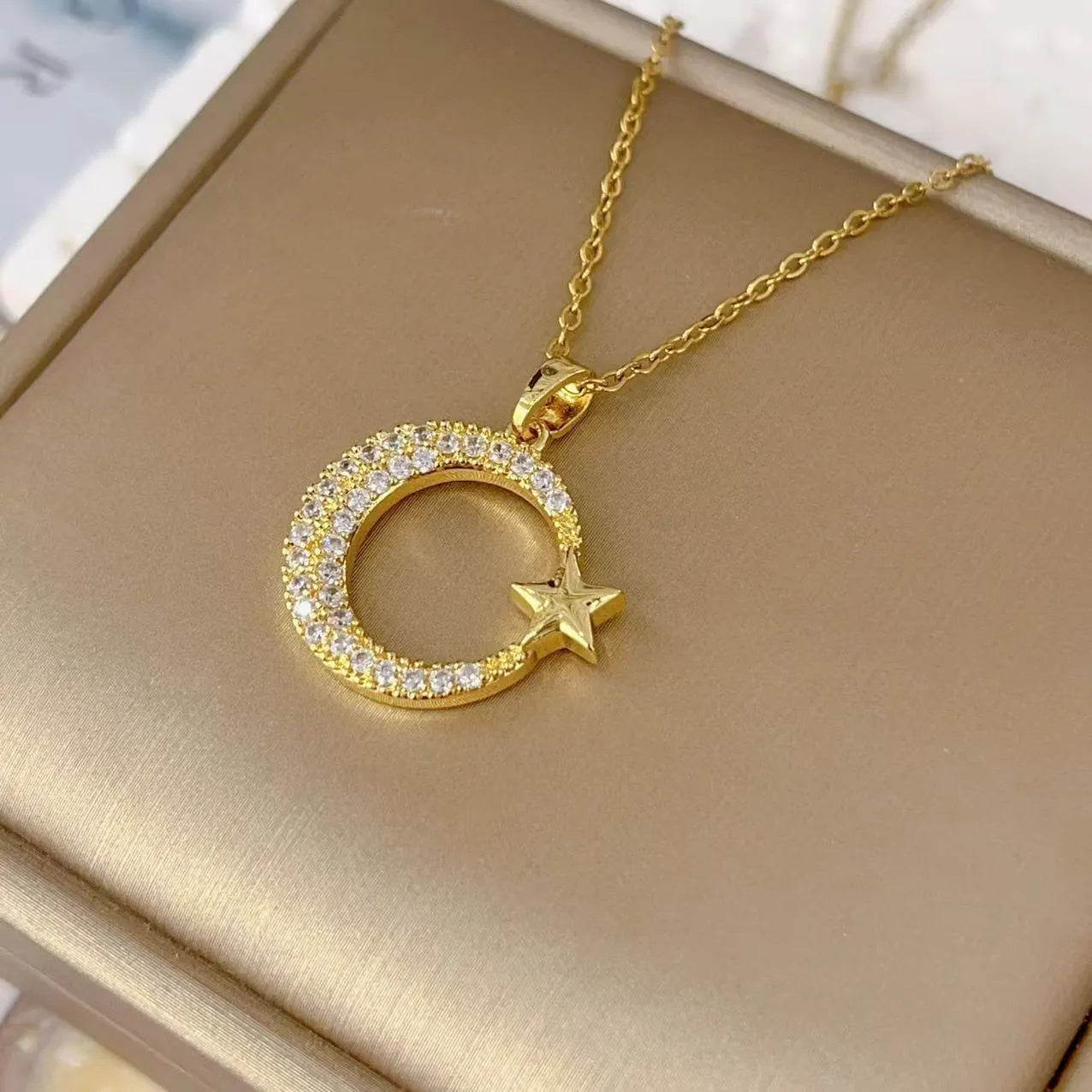 Gold electroplated geometric moon zircon pendant on titanium steel O-ring chain necklace