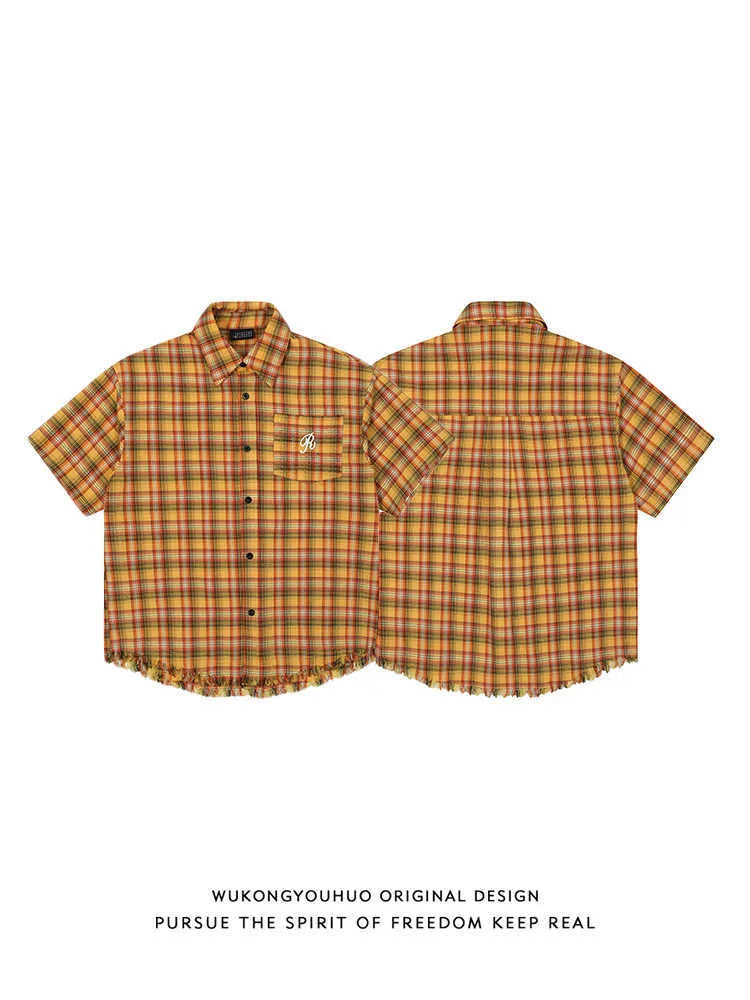 Yellow check short-sleeve plaid shirt with an embroidered chest pocket, shown on a hanger.