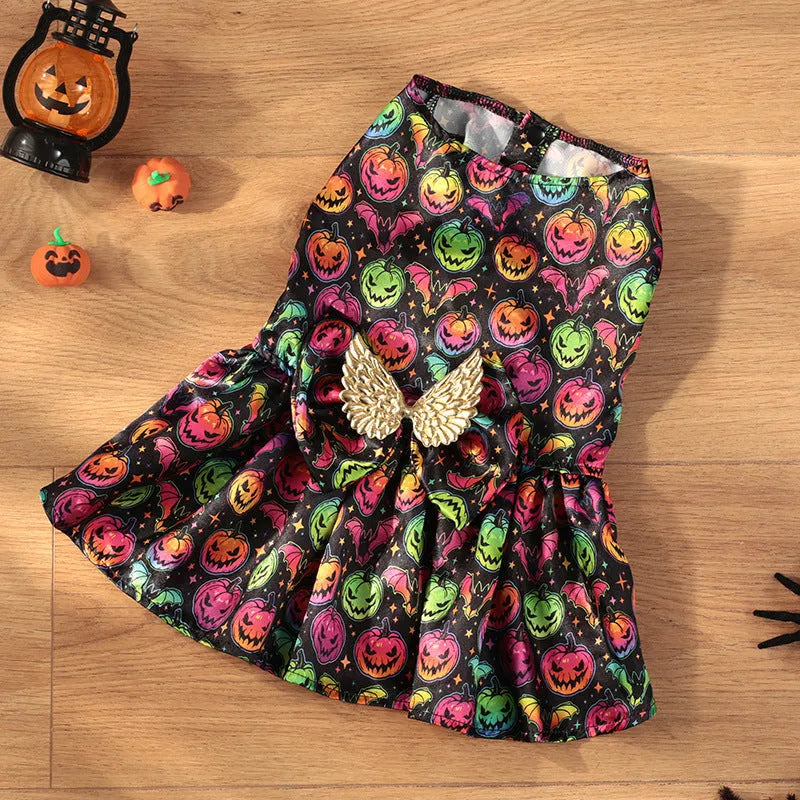Dog wearing an angel wings Halloween costume in bright orange or purple colours