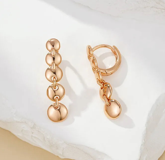 Retro gold tone woven copper circle drop earrings with vintage styling