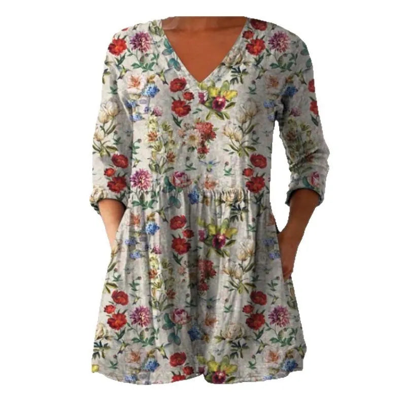 Women's loose fitted printed wave dress with 3/4 sleeves and wide waistband on hanger