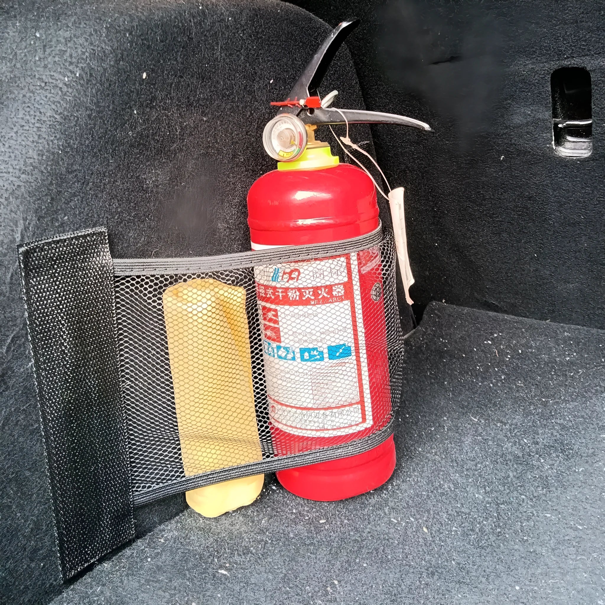 Durable polyester elastic storage net for a car boot, shown in 20x45cm size.