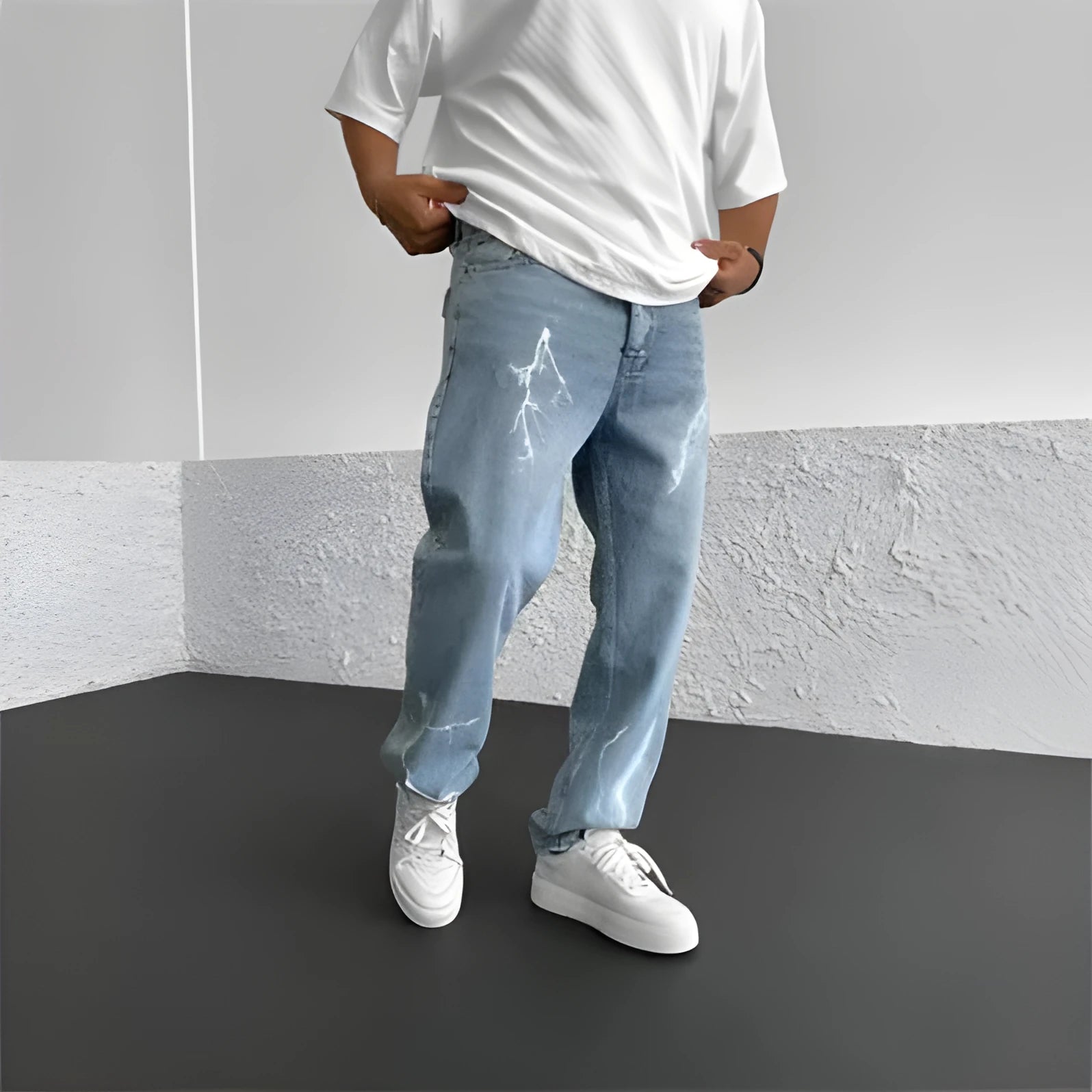 Men's blue straight-leg cotton denim trousers with a wide-leg fit and five-pocket design on a neutral background.