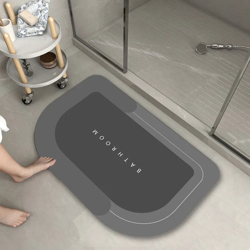 Bathroom floor mat in blue colour, oval shape, showing machine-woven blended texture