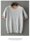 Men's grey short sleeve wool sweater with a round neck, laid flat