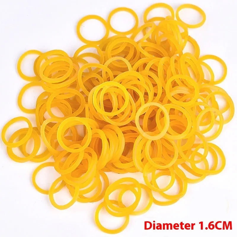 Yellow rubber bands in various sizes from a 500g mixed diameter pack