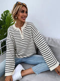 Black and white striped women's casual top with drop-shoulder sleeves and loose fit