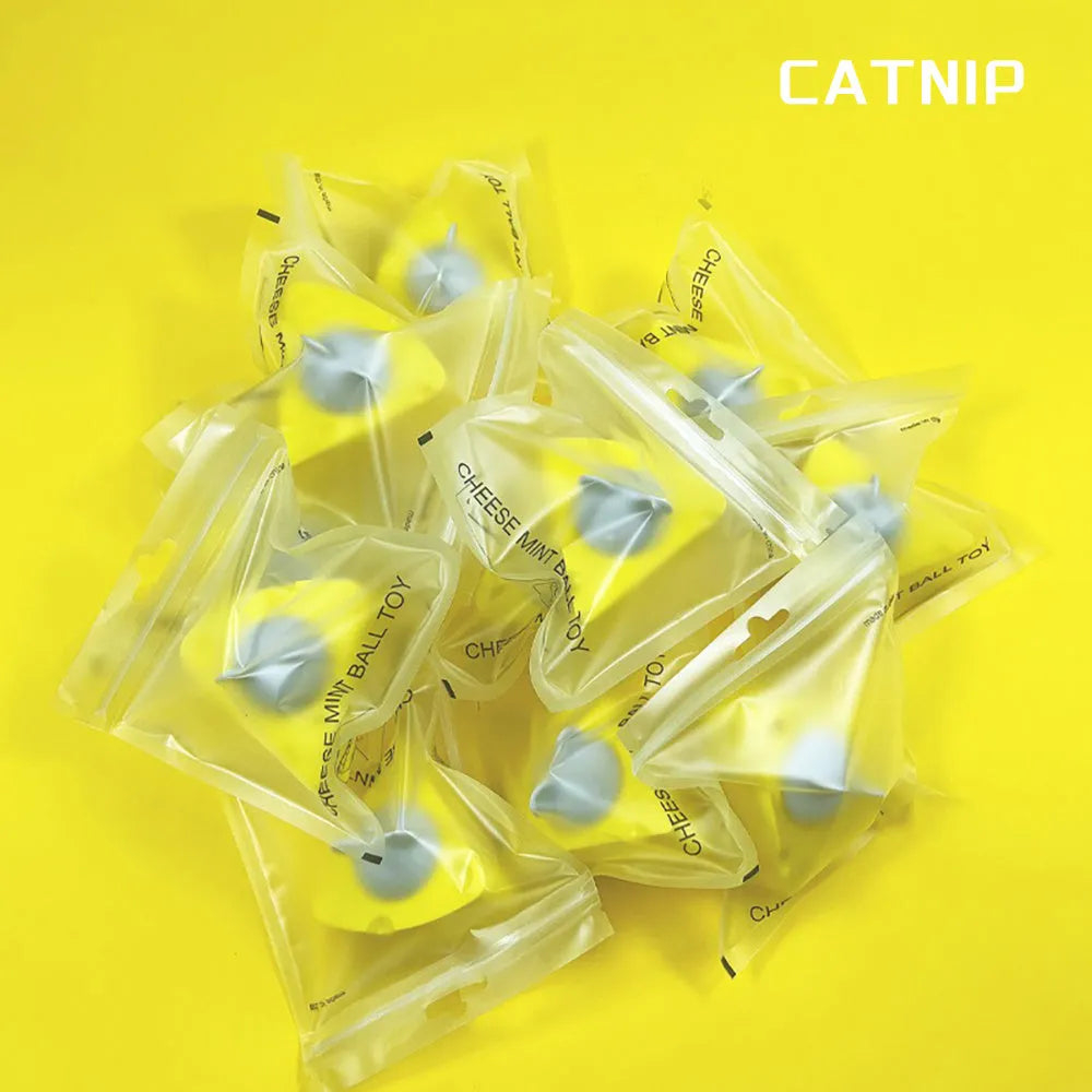 Yellow catnip and silvervine chew toy ball for cats on a plain background.