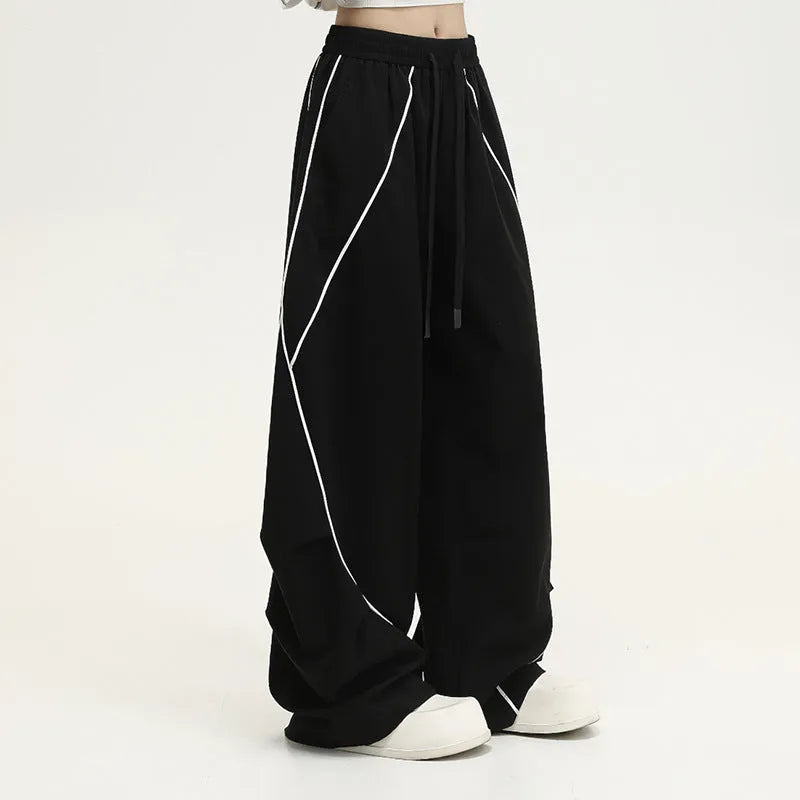 Black pleated wide-leg trousers with striped pattern for hip hop dance and streetwear
