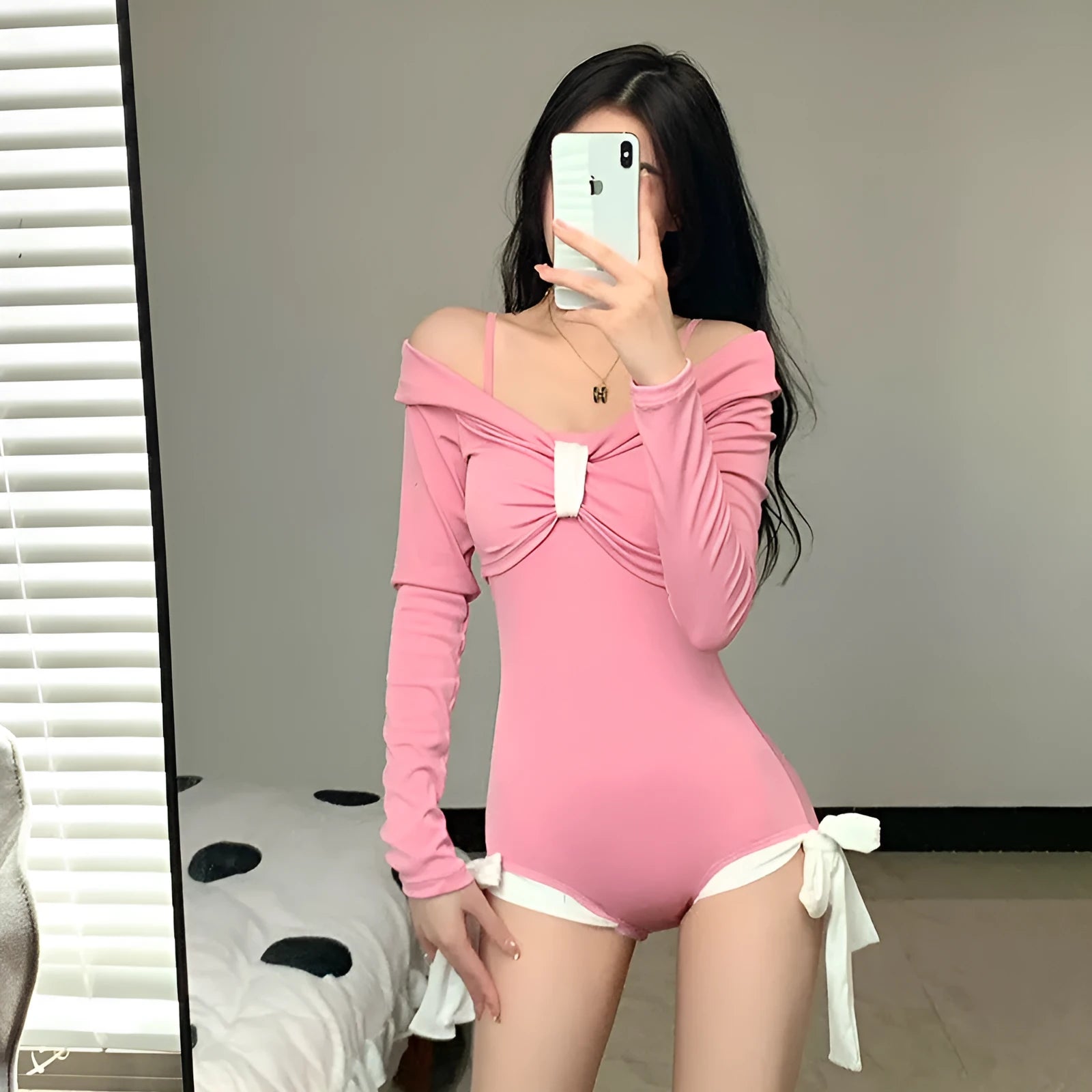 Women's long-sleeved one-piece swimsuit in polyester fibre available in pink and black colours