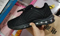 Men's black casual sneakers with lace-up front, thick sole, and round toe for running and outdoor sports.