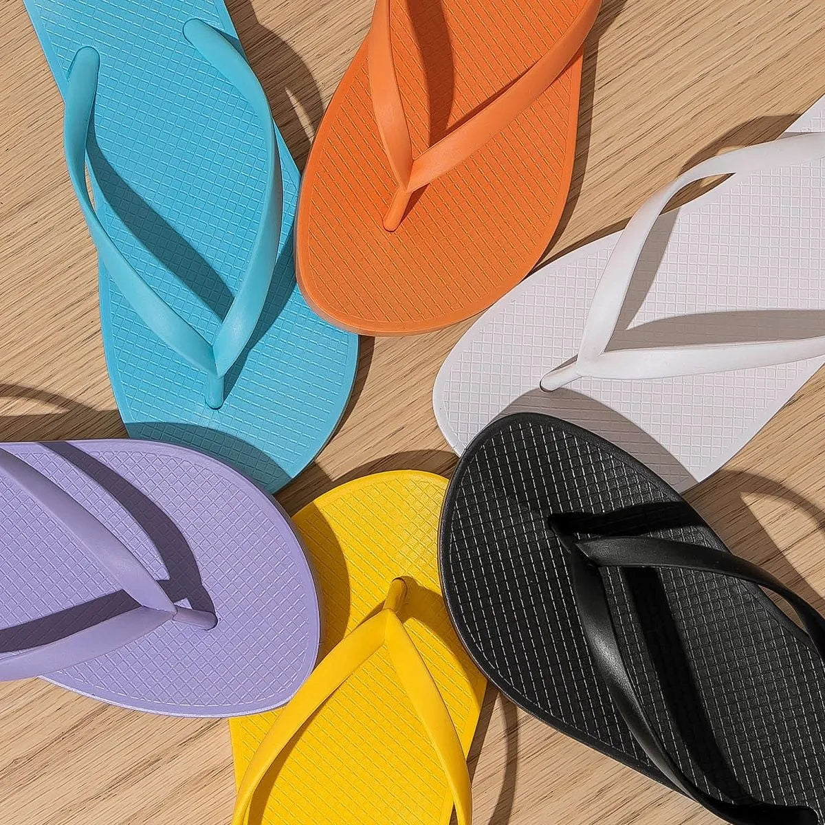Seaside non-slip breathable flat slippers with hollow out design and injection moulded PVC sole in orange purple black white