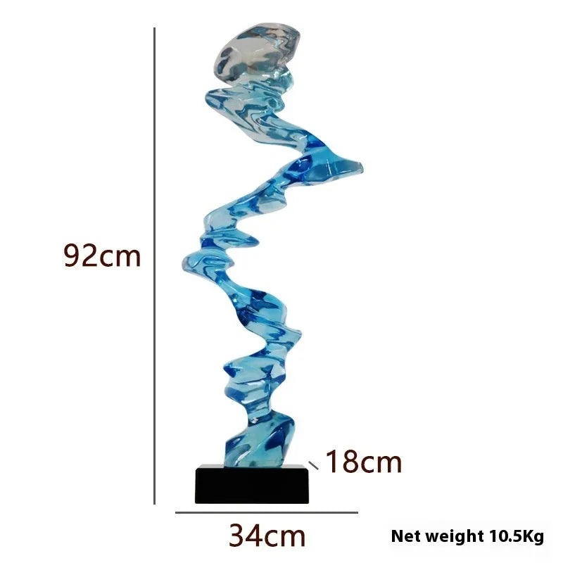 Modern abstract still life sculpture ornament in natural resin on a wooden table.