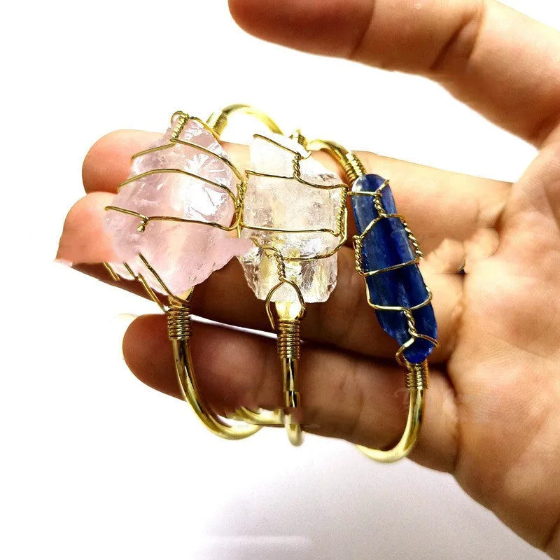 Natural crystal rough stone bracelet with gold metal winding in a geometric bohemian design