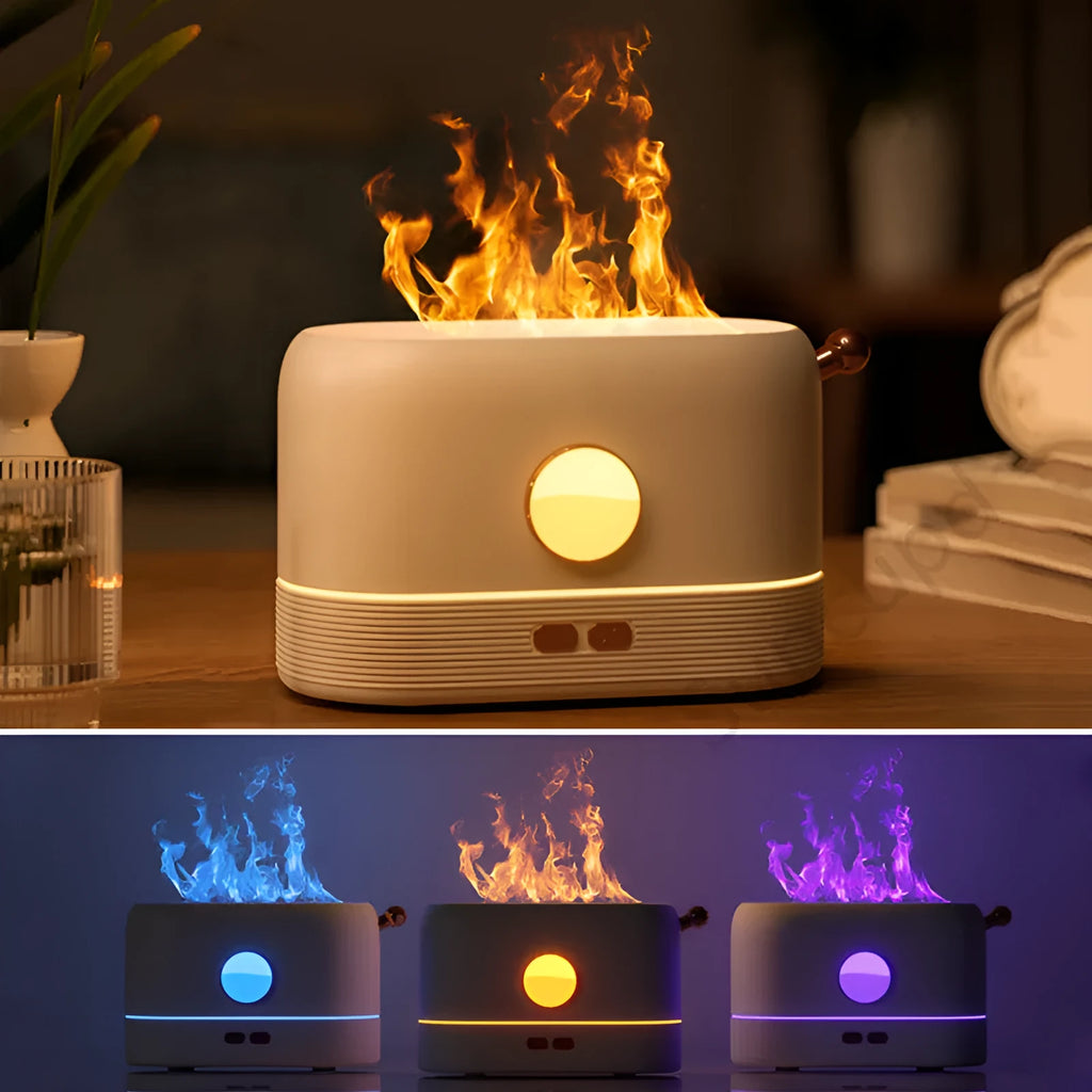 Black USB humidifier with flickering flame effect on a wooden desk next to a plant.