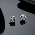 Pair of black titanium steel geometric star clip-on earrings