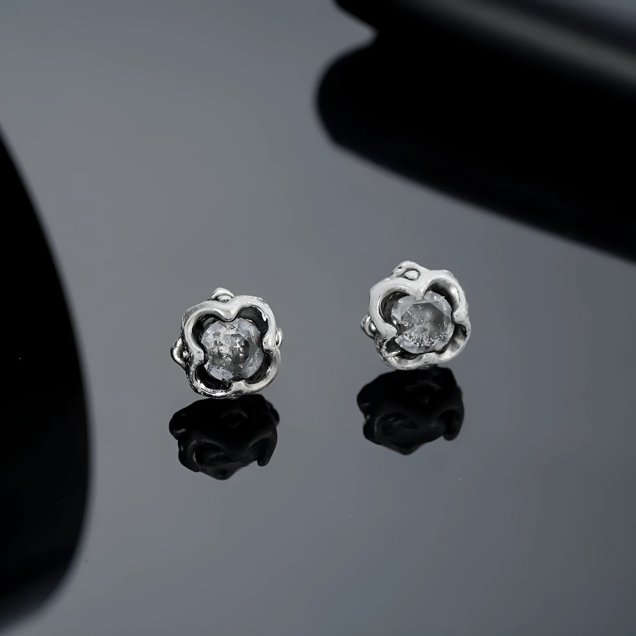 Pair of black titanium steel geometric star clip-on earrings