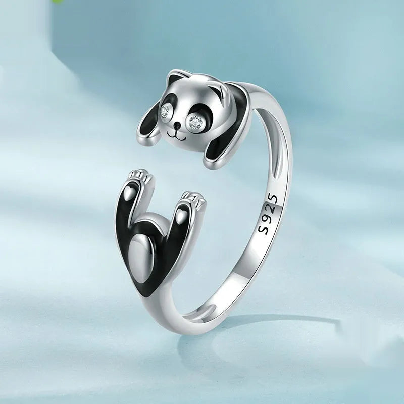 Adjustable sterling silver panda open ring with white gold plating, showing animal design and opening mechanism