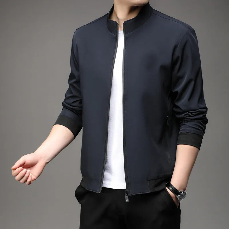Man wearing a loose-fit Korean-style casual jacket in a dark colour, showing the lapel design, zip, and pockets.