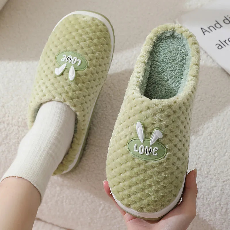 Women's rabbit plaid design artificial fur house slippers with thick rubber soles in apricot colour.
