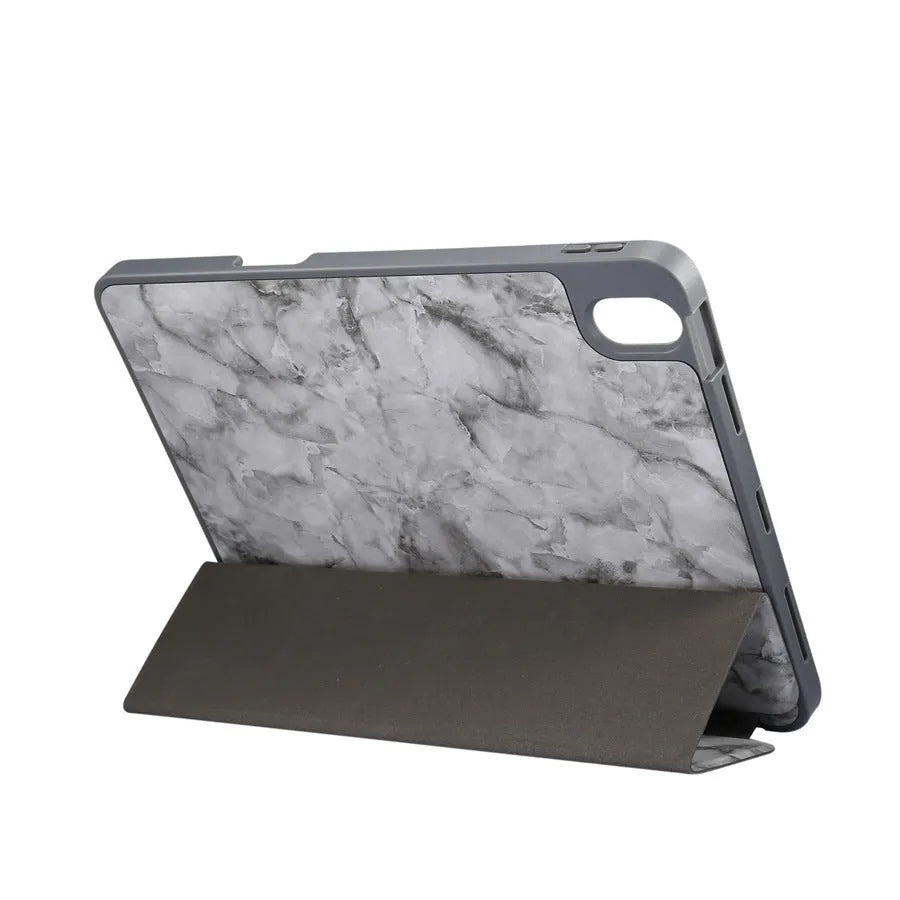iPad tri-fold leather case with marbling design showing built-in Apple Pencil slot and plane housing construction