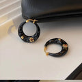 Hong Kong style retro ear studs with rhinestone detailing in black and red colour options