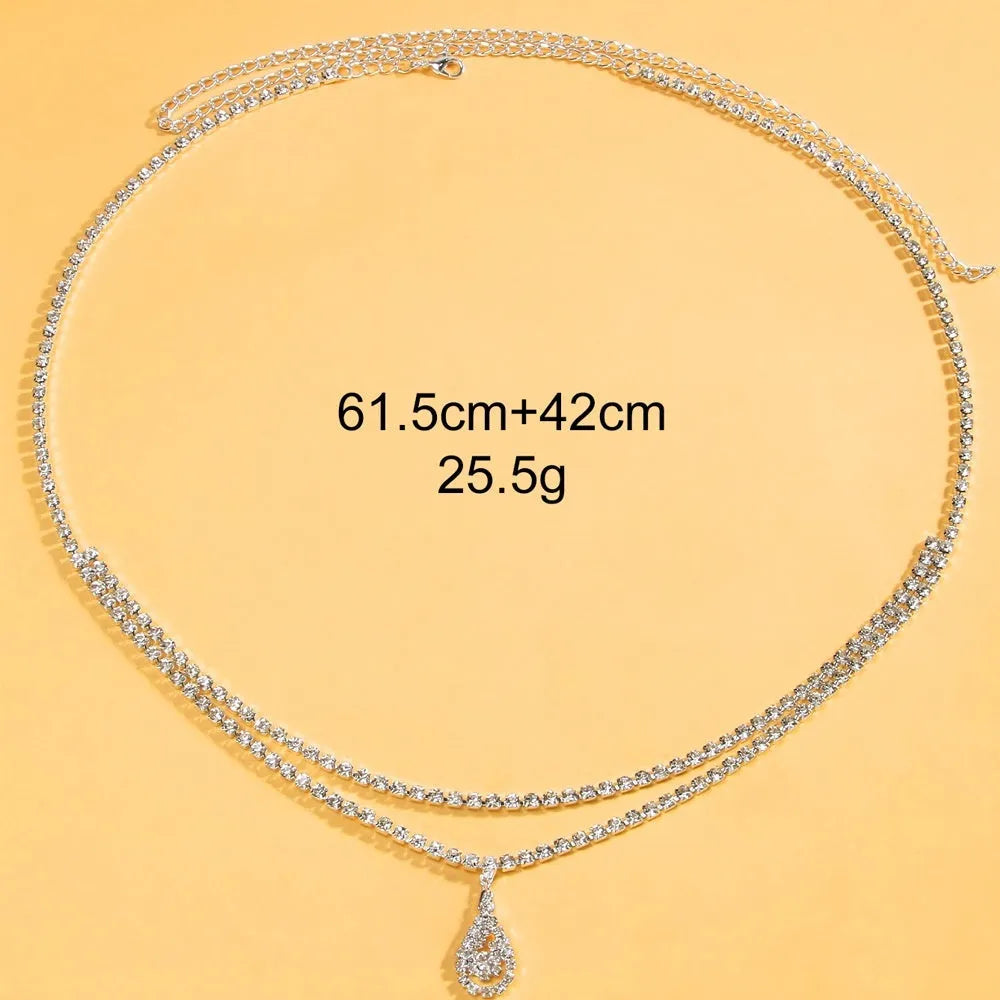 Gold waist chain with rhinestone decoration and lobster buckle clasp measuring 105cm length
