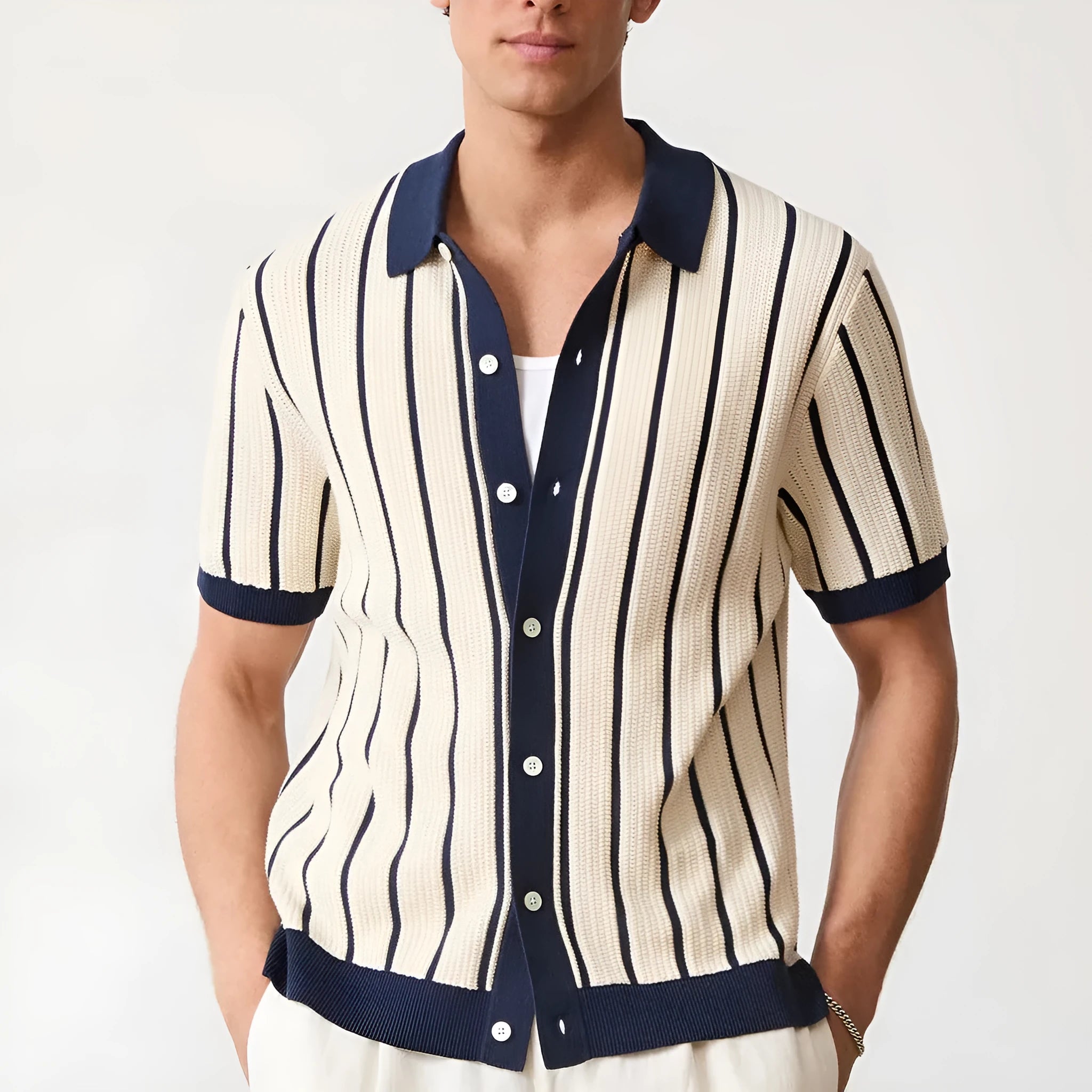 Men's white asymmetric knitted polo shirt with lapel collar and short sleeves.