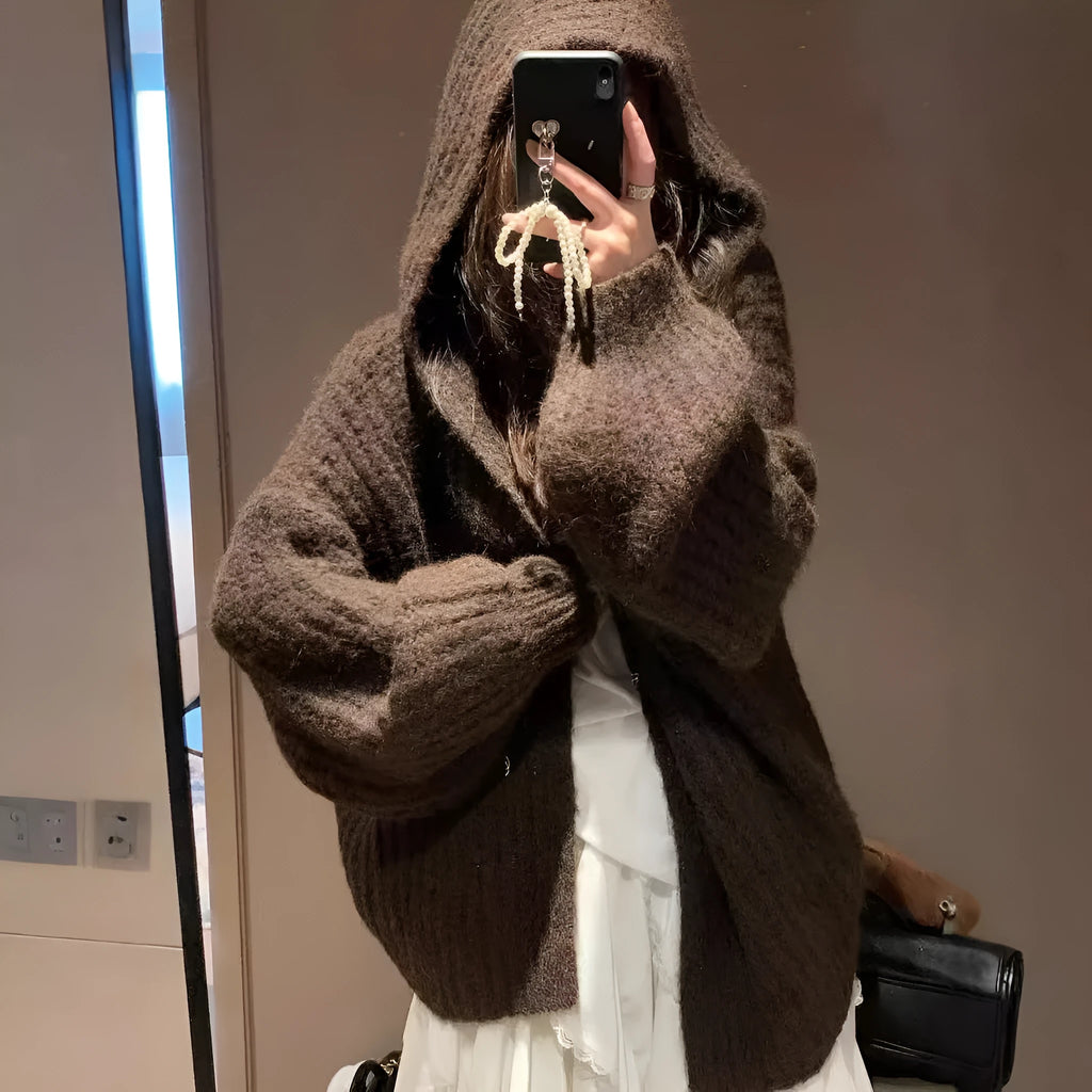 Women's loose-fit hooded cardigan in thick fabric, shown in dark grey, brown, and milky white colours.