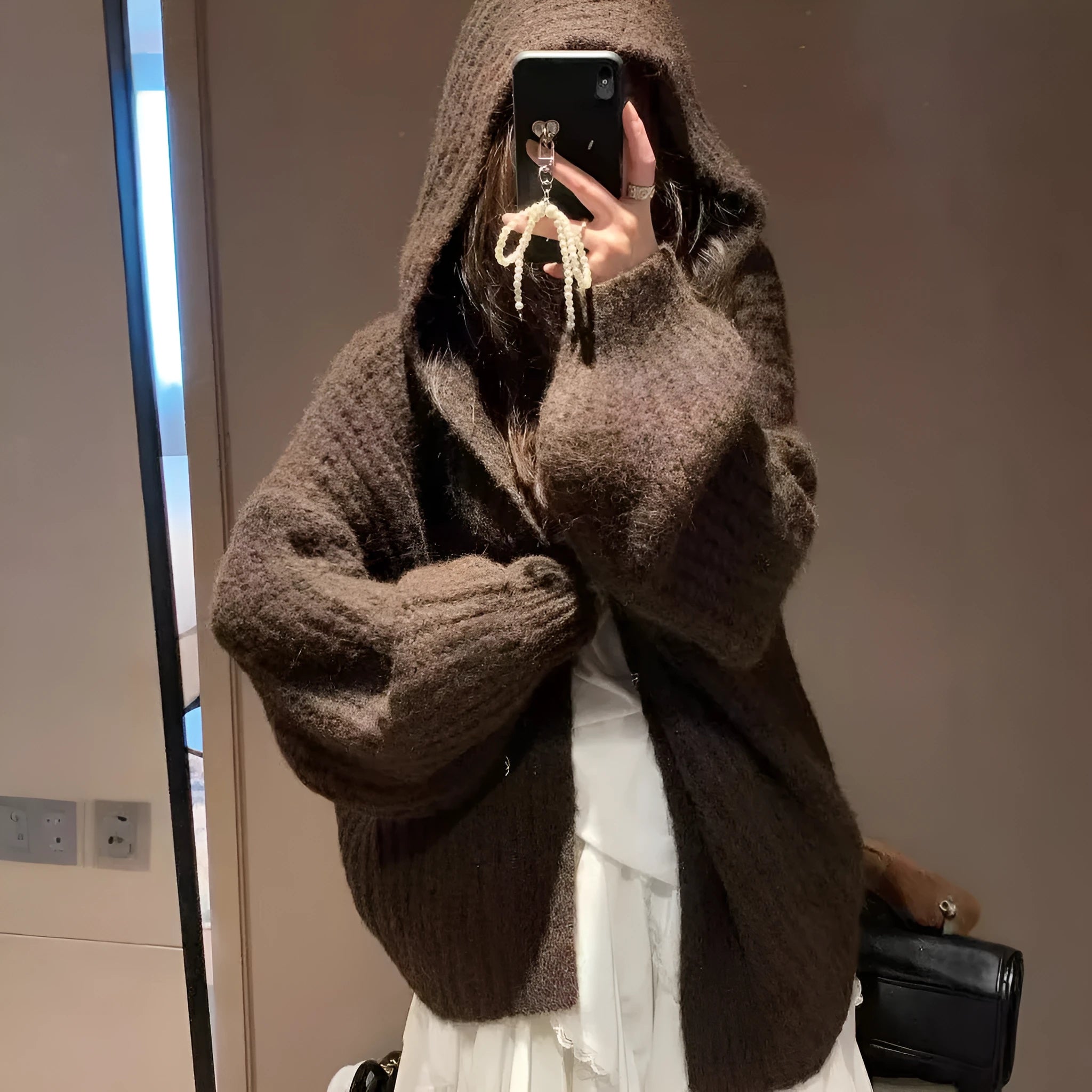 Women's loose-fit hooded cardigan in thick fabric, shown in dark grey, brown, and milky white colours.