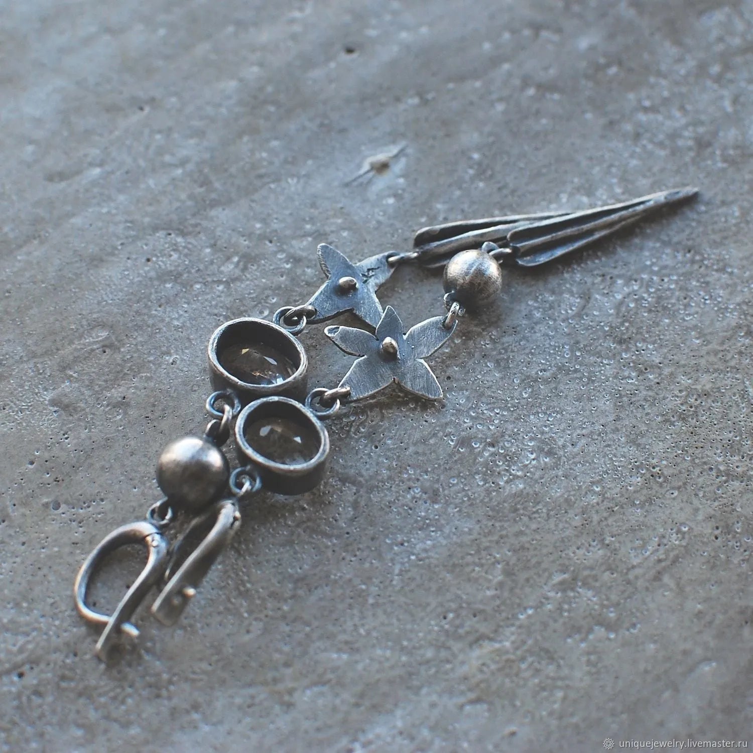 Geometric antique silver pendant earrings with XINGX rhinestone design