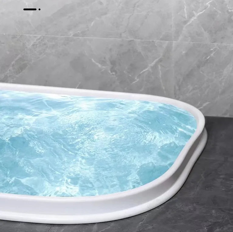Flexible silicone bathroom waterproof strip in black colour showing water barrier installation