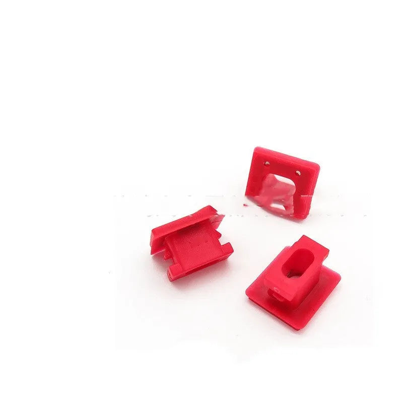 10 plastic BMW interior door trim panel repair clips and buckles on a white background