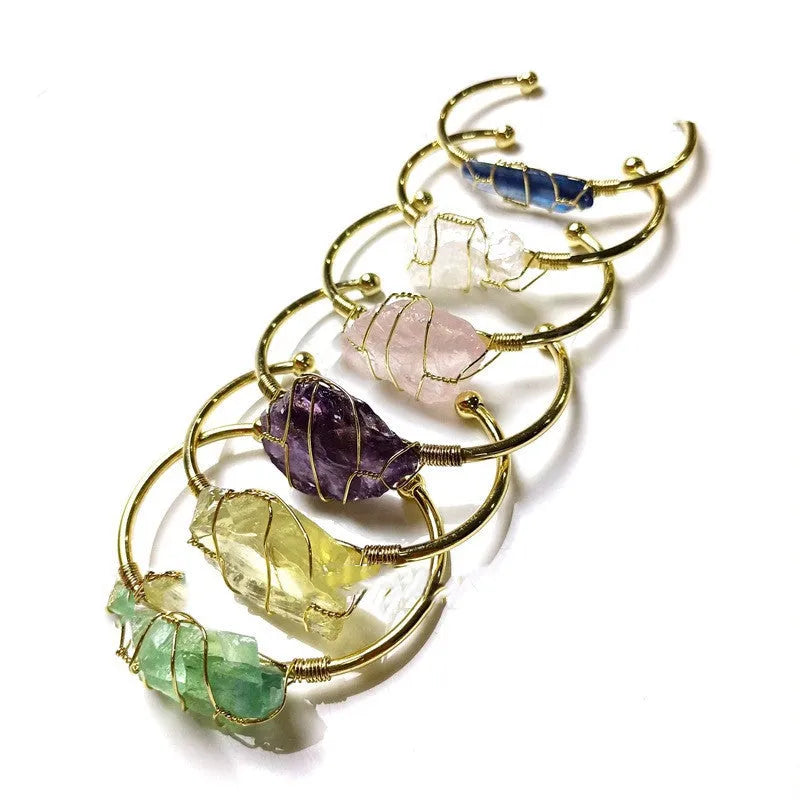 Natural crystal rough stone bracelet with gold metal winding in a geometric bohemian design