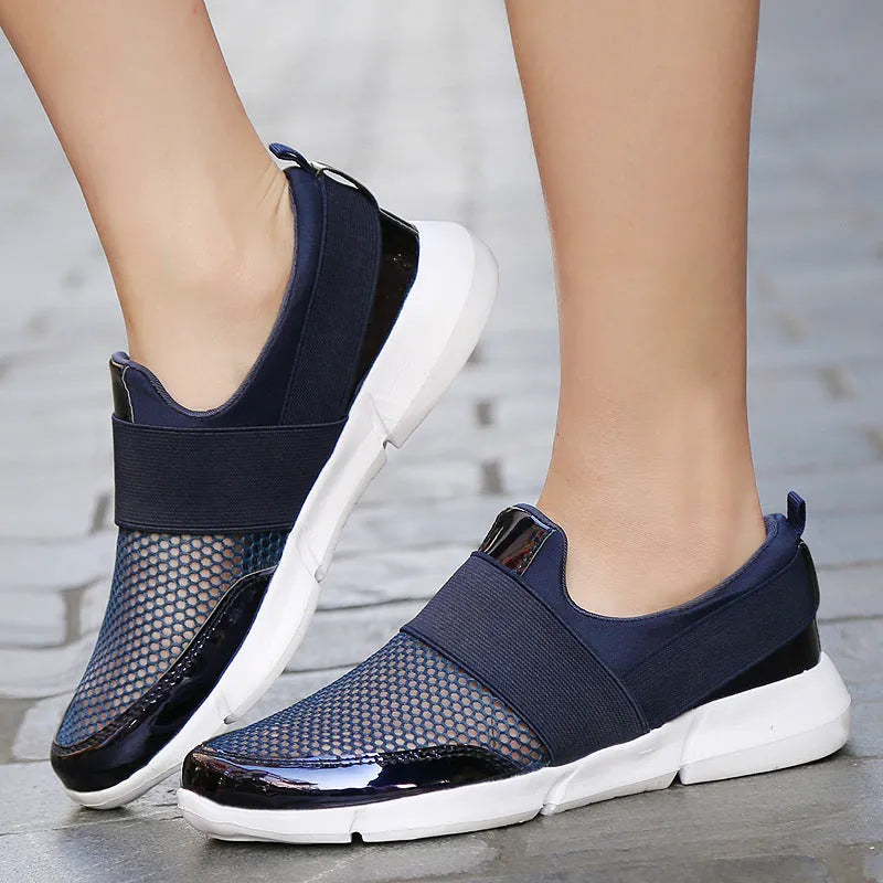 Women's low-top casual sneakers in blue, featuring a breathable mesh interior and a colour-matching pattern.