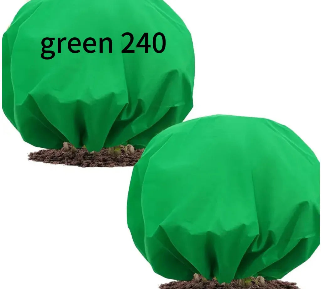 Round green non-woven plant frost cover with drawstring resting on grass, showing 1.9m diameter size