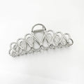 Large minimalist updo hair clip with tassel detail in gold or silver electroplated finish