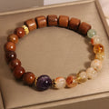 Women's mosaic bracelet with pineapple yellow tower crystal and ebony amethyst with pearl and rhinestone accents
