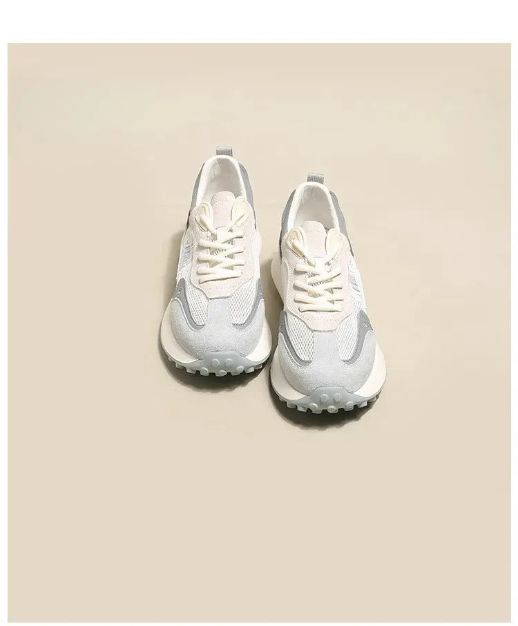 Women's grey and pink retro sneaker with low-top design and round toe