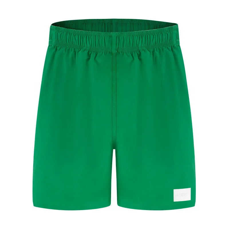 Men's solid colour quick-dry nylon sports shorts with straight leg opening.