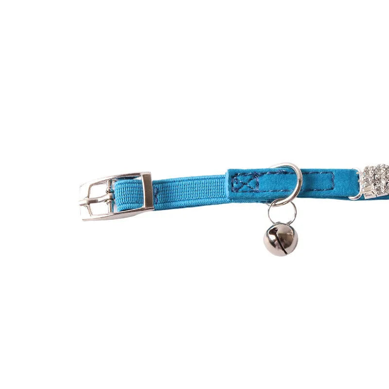 Flocked material cat collar with elastic buckle in assorted colours on a white background.