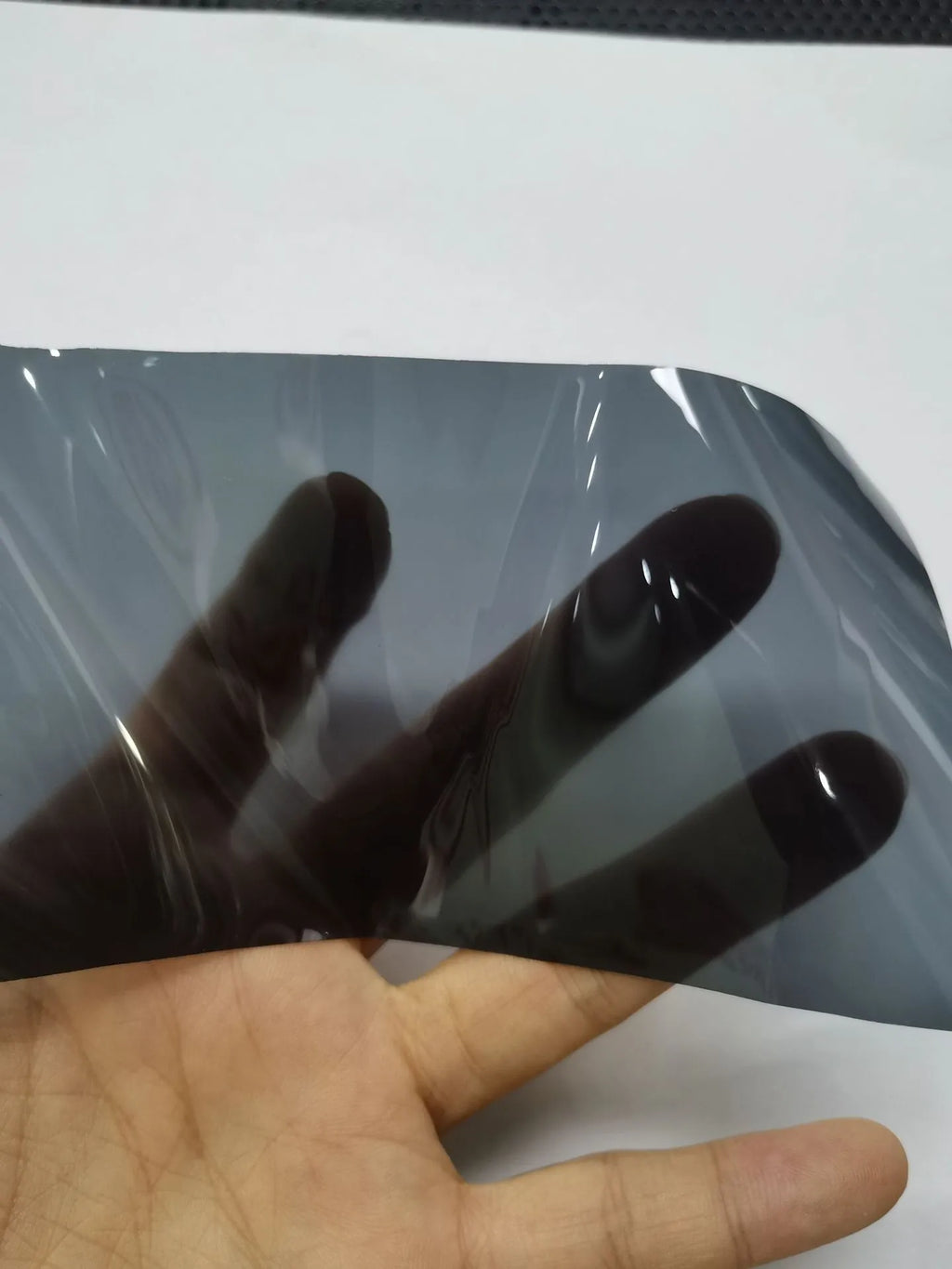 Roll of 30cm wide transparent protective film for car plastic headlamps and tail lights.