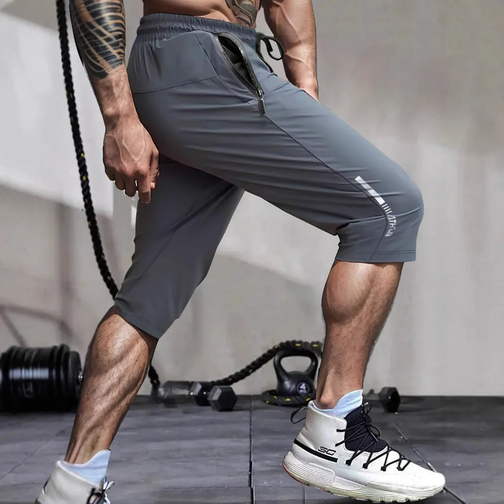 Men's black quick-dry nylon cropped sports pants with elastic waistband and straight-leg design