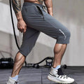 Men's black quick-dry nylon cropped sports pants with elastic waistband and straight-leg design