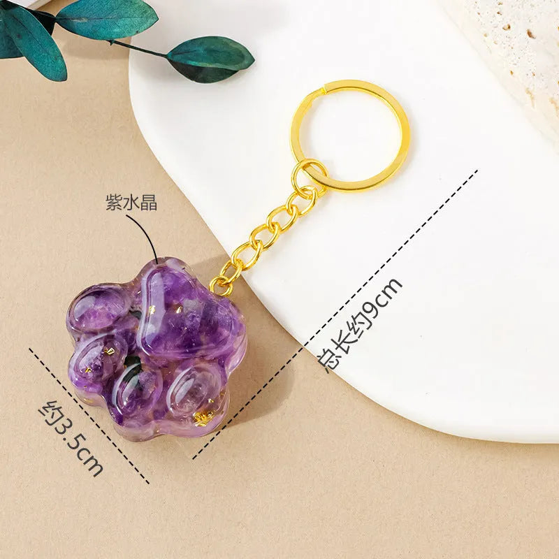Natural crystal cat's paw keychain pendant in various gemstone colours including pink, red, blue and green crystals