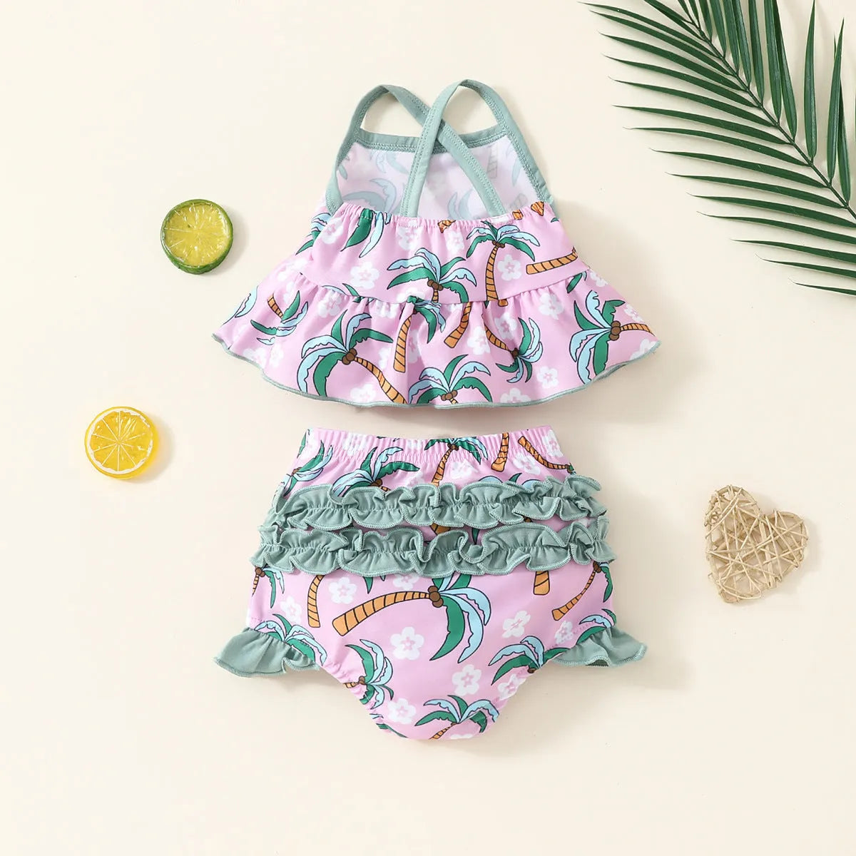 White children's swimsuit set consisting of top and shorts for beach and pool use