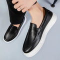 Men's casual British style slip-on shoes in PU leather with round toe, shown in white colour