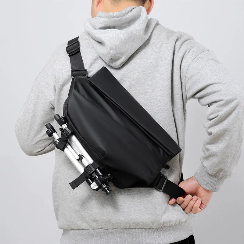 Grey men's medium horizontal PU crossbody sling bag with a single shoulder strap.
