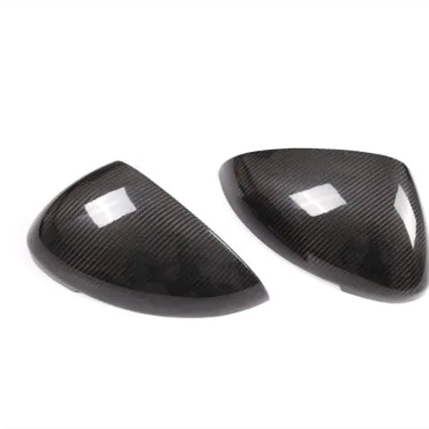 Pair of matte black true carbon fibre rearview mirror covers for a Porsche Macan.